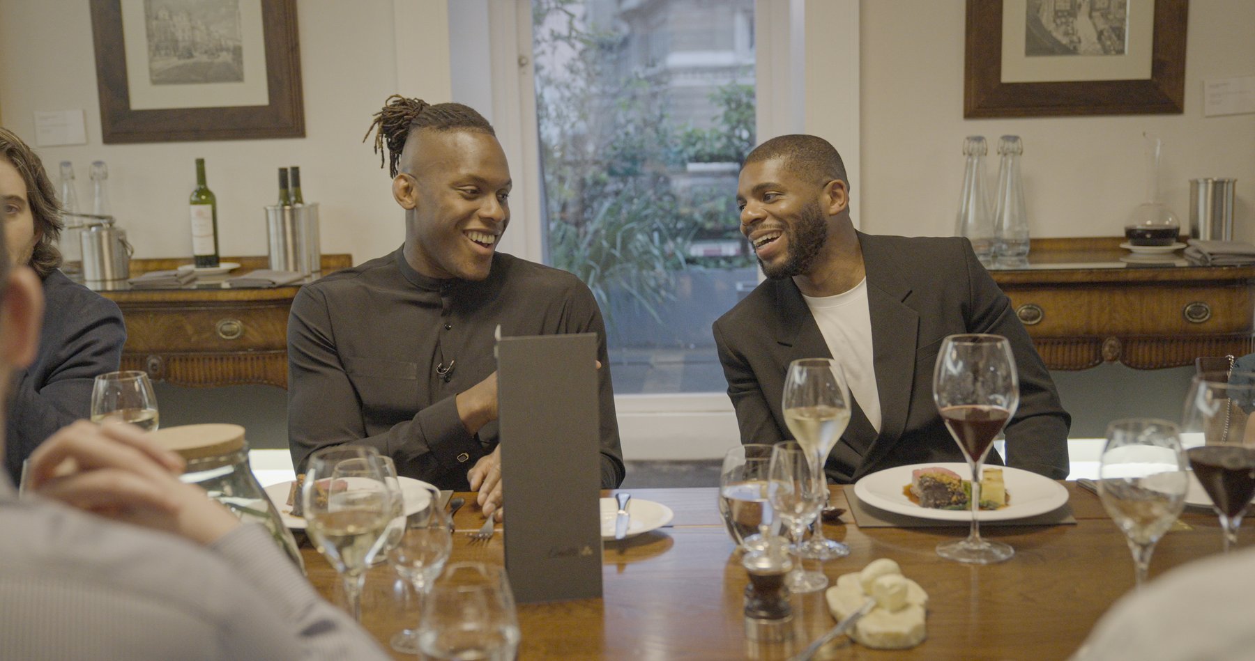 Client-supplied photograph of a conversation at a dinner